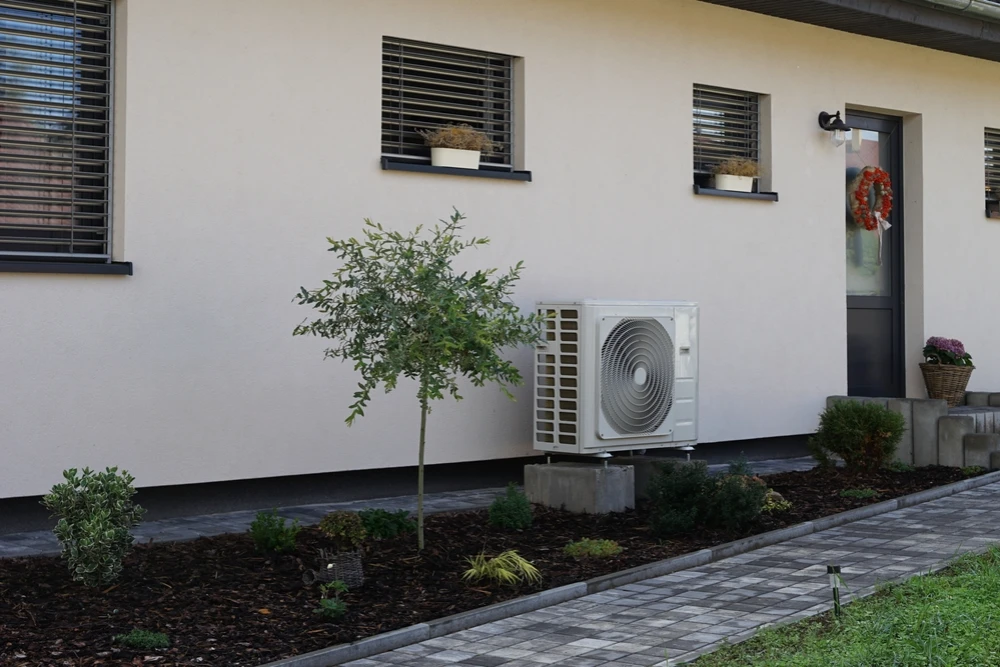 air source heat pump outside a house